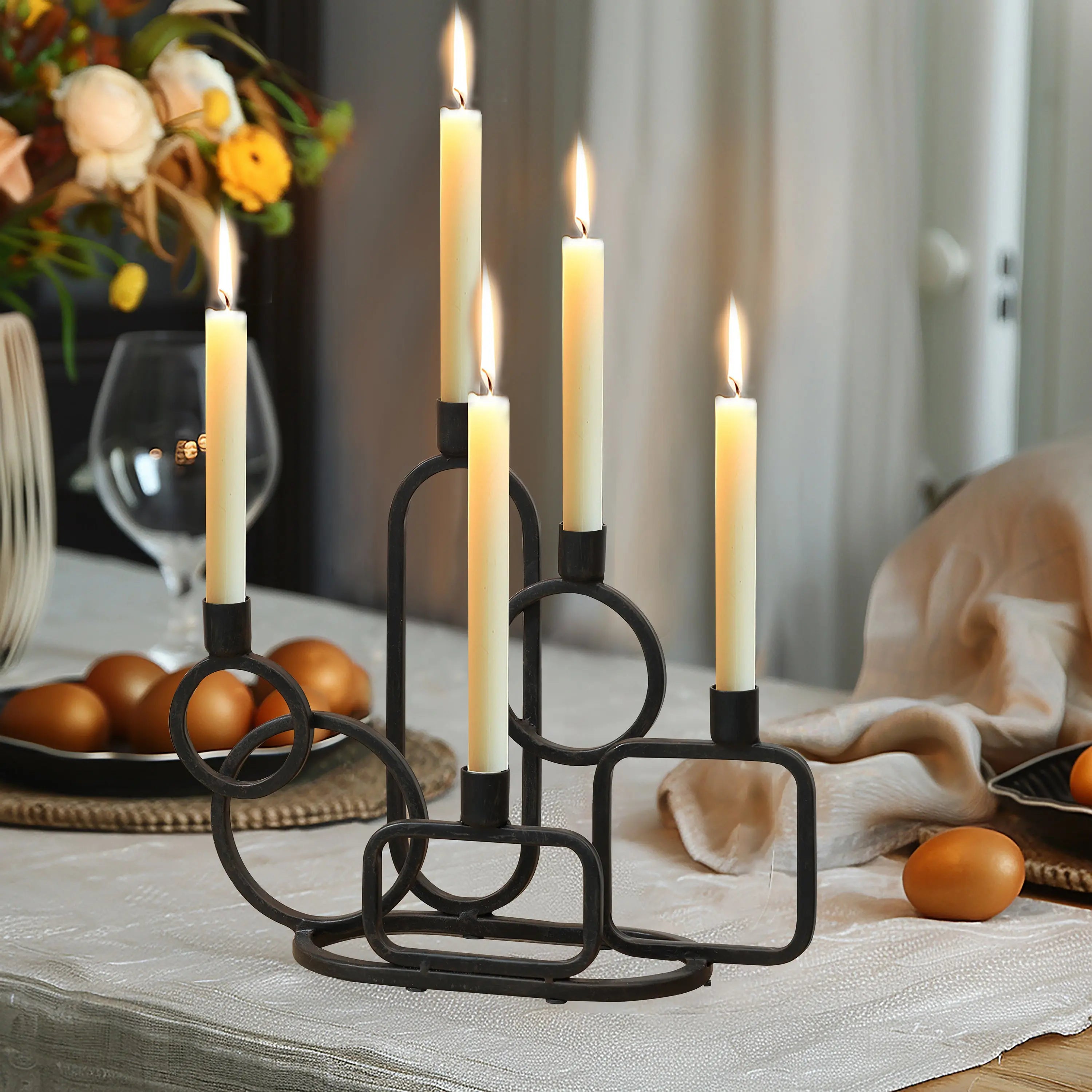 black-candelabra-and-candles-on-a-dining-table