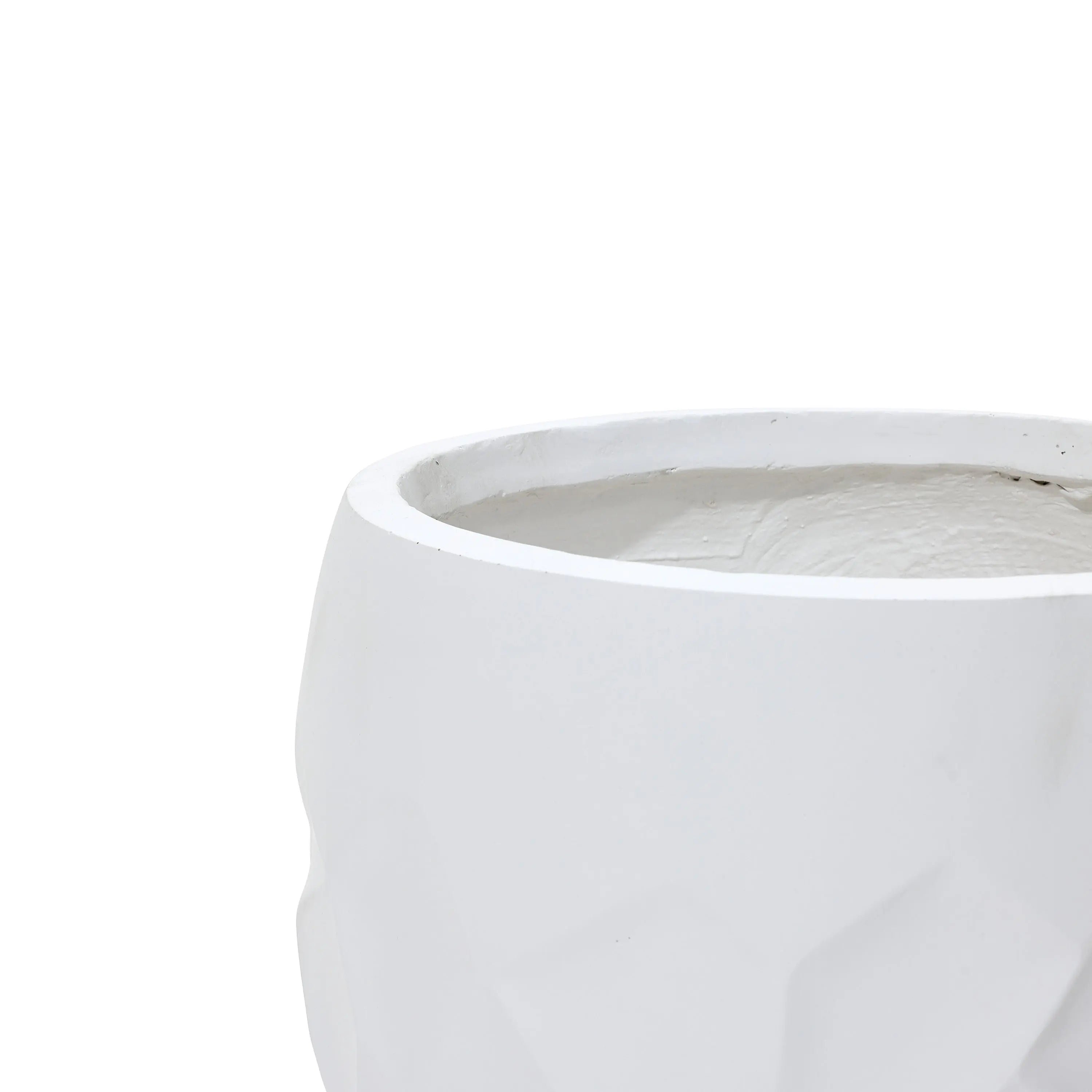 White, faceted geometric pot planter made from durable magnesium oxide material, suitable for both indoor and outdoor use, against a plain background.