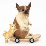 A durable resin sculpture featuring a French bulldog statue sits on a skateboard with a small cat standing beside it, perfect for eclectic style decor.