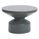 Contemporary round coffee table featuring a modern gray finish, with a wide, flat top and sculptural, tapered pedestal base crafted from durable magnesium oxide material.