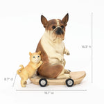 A French bulldog statue, crafted from durable resin, sits on a wheeled board with a cat standing beside it. This eclectic style decor piece measures 16.3 h, 16.1 w, and 8.7 d, adding charm to any setting.