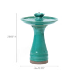 Green ceramic bird bath with a pedestal base and an elegant lotus design, measuring 22.05 inches in height and 12.99 inches in diameter—a striking decorative garden piece that enhances any outdoor space.