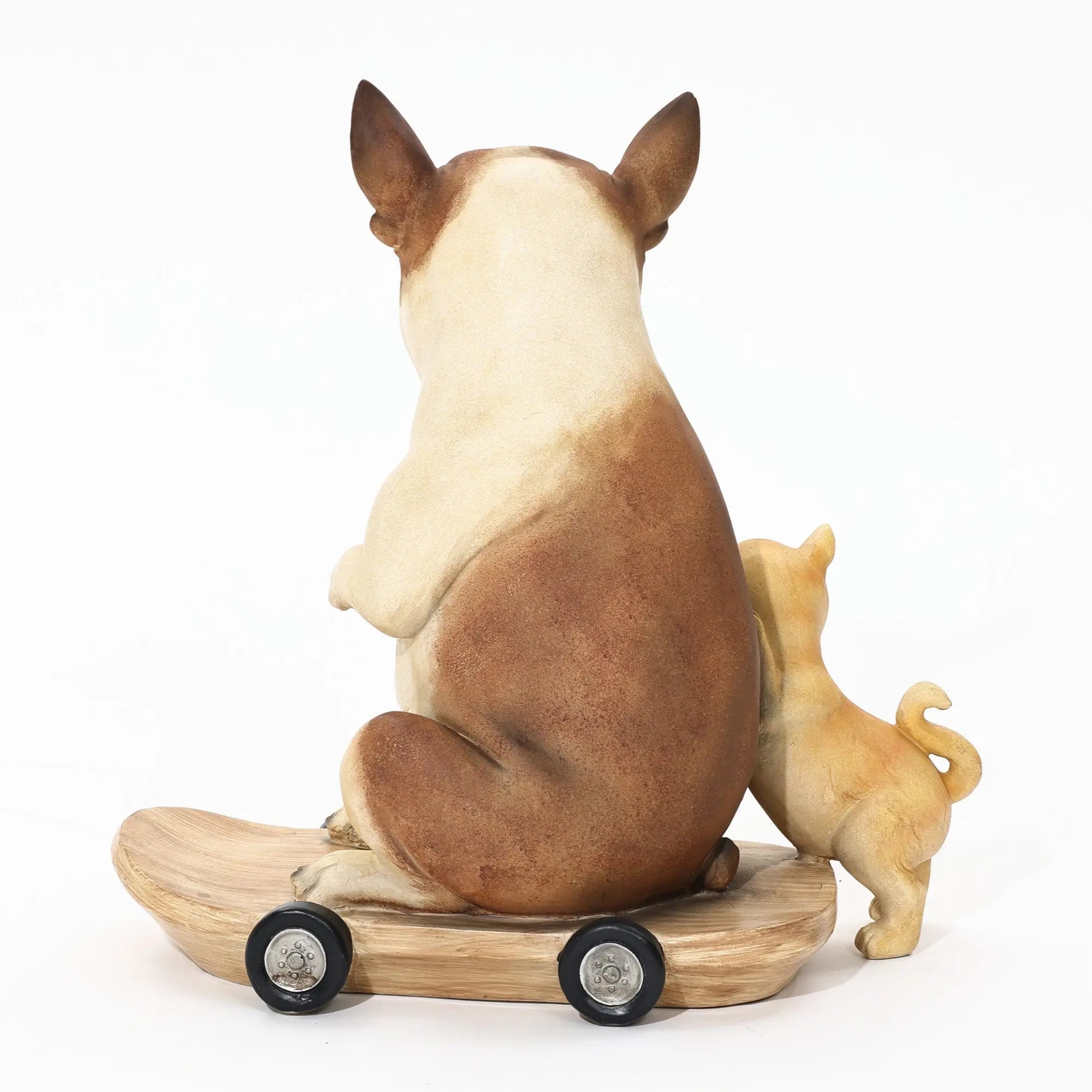 Two dog figurines sit on a wheeled wooden base, facing away. The larger French bulldog statue appears to be a bulldog, and the smaller dog stands closely beside it. Perfect for eclectic style decor, this pair adds charm and character to any space.