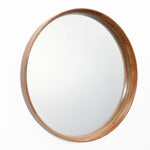 A round mirror with a natural wood finish frame on a white background.