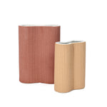 two-cylindrical-planters-one-in-terracotta-and-the-other-in-light-brown