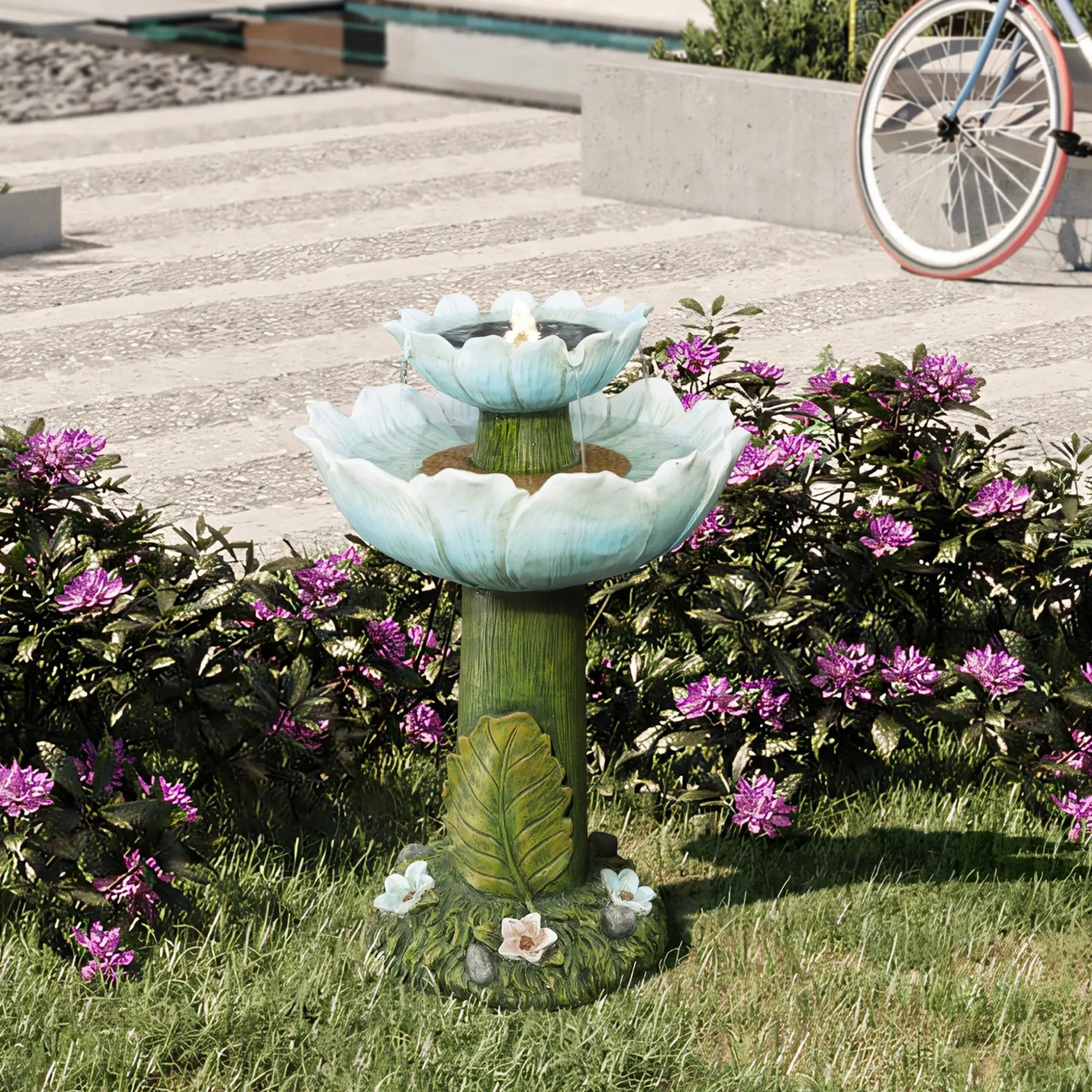 blue-water-fountain-with-flowers-in-a-garden