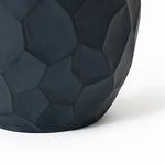 Close-up of a dark, hexagonal-patterned geometric pot planter crafted from magnesium oxide material, suitable for both indoor and outdoor use, on a white background.