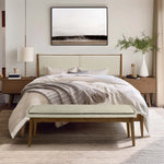 bedroom-with-a-large-bed-bench-and-wall-mounted-TV
