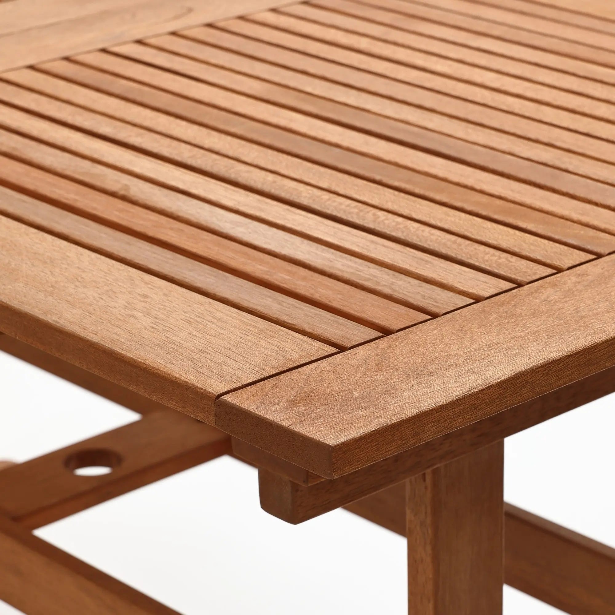  teak-outdoor-dining -table-with-a-slatted-design