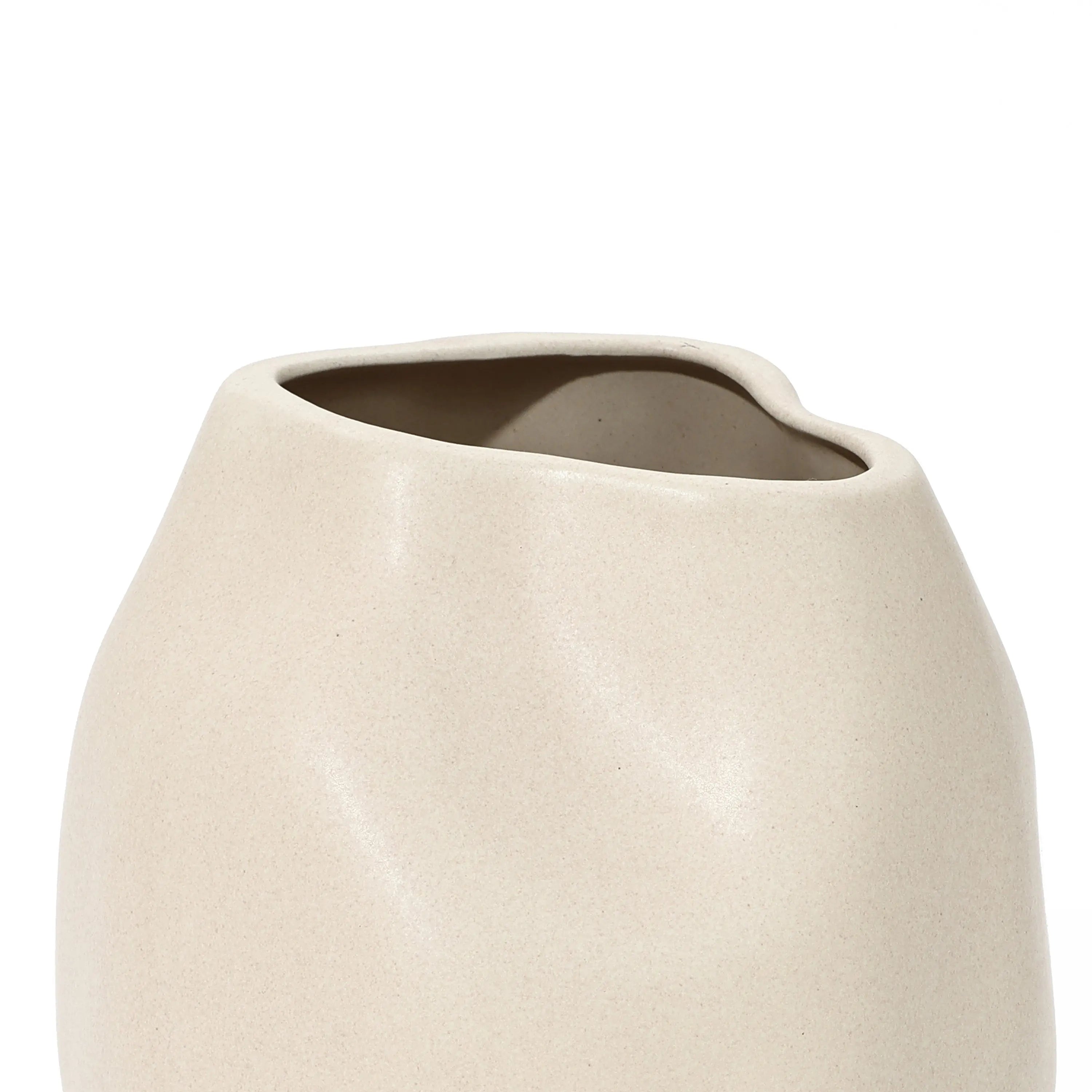 Ivory white ceramic vase featuring an asymmetrical, wavy rim and smooth surface, perfect as a striking accent piece.