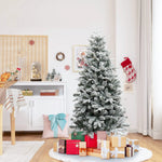 flocked-christmas-tree-and-presents-in-a-living-room