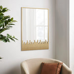 mirror-with-a-gold-frame-and-a-city-skyline-design
