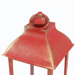 holiday-lantern-features-decorative-pine-needles-cones-and-red-holly-berries