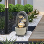 outdoor-fountain-in-modern-backyard-on-cobblestone-by-the-sidewalk