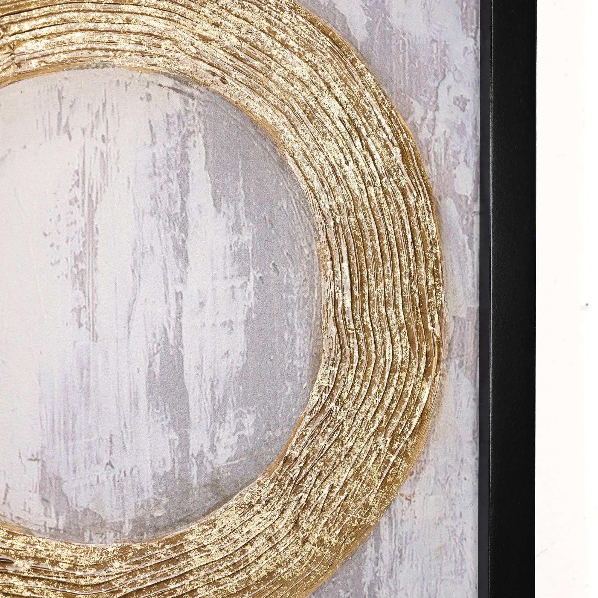 Close-up of a textured, gold metal design in a circular pattern on a gray and white abstract background, elegantly framed in black. Perfect for enhancing your home decor with sophisticated wall decor.