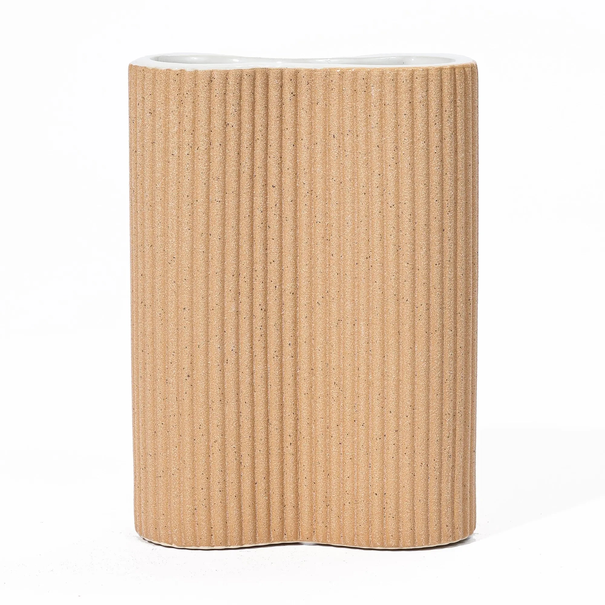 cylindrical-tan-colored-vase-with-a-white-top