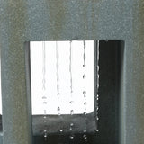 Close-up of water droplets falling in straight lines through a rectangular opening in a textured grey structure, creating a striking water fountain feature perfect for any outdoor living space.