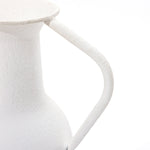 Close-up of a white, textured metal pitcher with a curved handle against a plain white background, embodying modern minimalist design. Perfect as part of your table vase set, this piece effortlessly elevates your home decor.