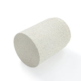 Image of a cylindrical pumice stone with a textured surface, reminiscent of cement material, shown on a white background.