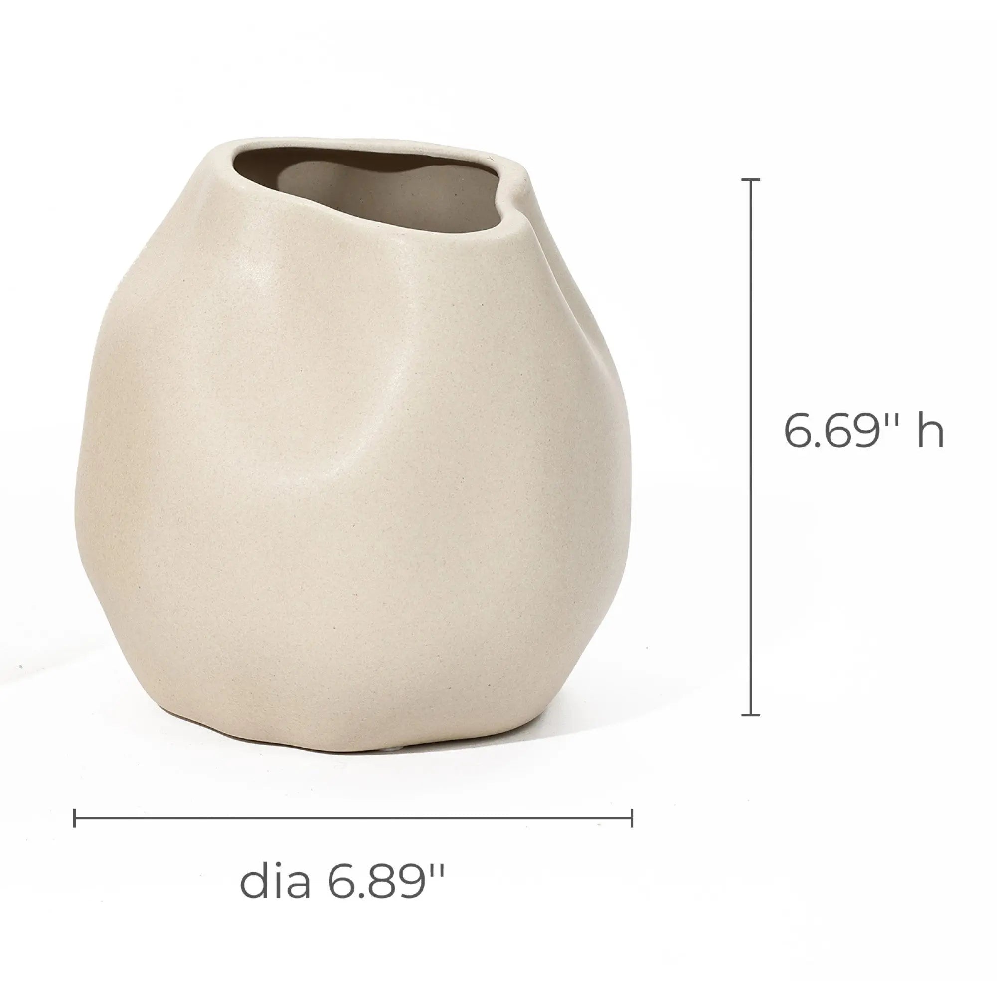 An ivory white, irregularly shaped ceramic vase serves as a charming accent piece with its measurements of 6.69 inches high and 6.89 inches in diameter.