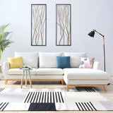 Modern living room with a white sectional sofa, colorful cushions, a floor lamp, a small side table, striking modern wall art as a focal point, a potted plant, and a striped rug on a light wood floor.