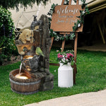 garden fountain with puppy and bird by the side of a farm entrance