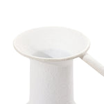 Close-up of a white, textured ceramic pitcher with a handle, featuring a wide, flared spout—a perfect piece for modern minimalist design in home decor.