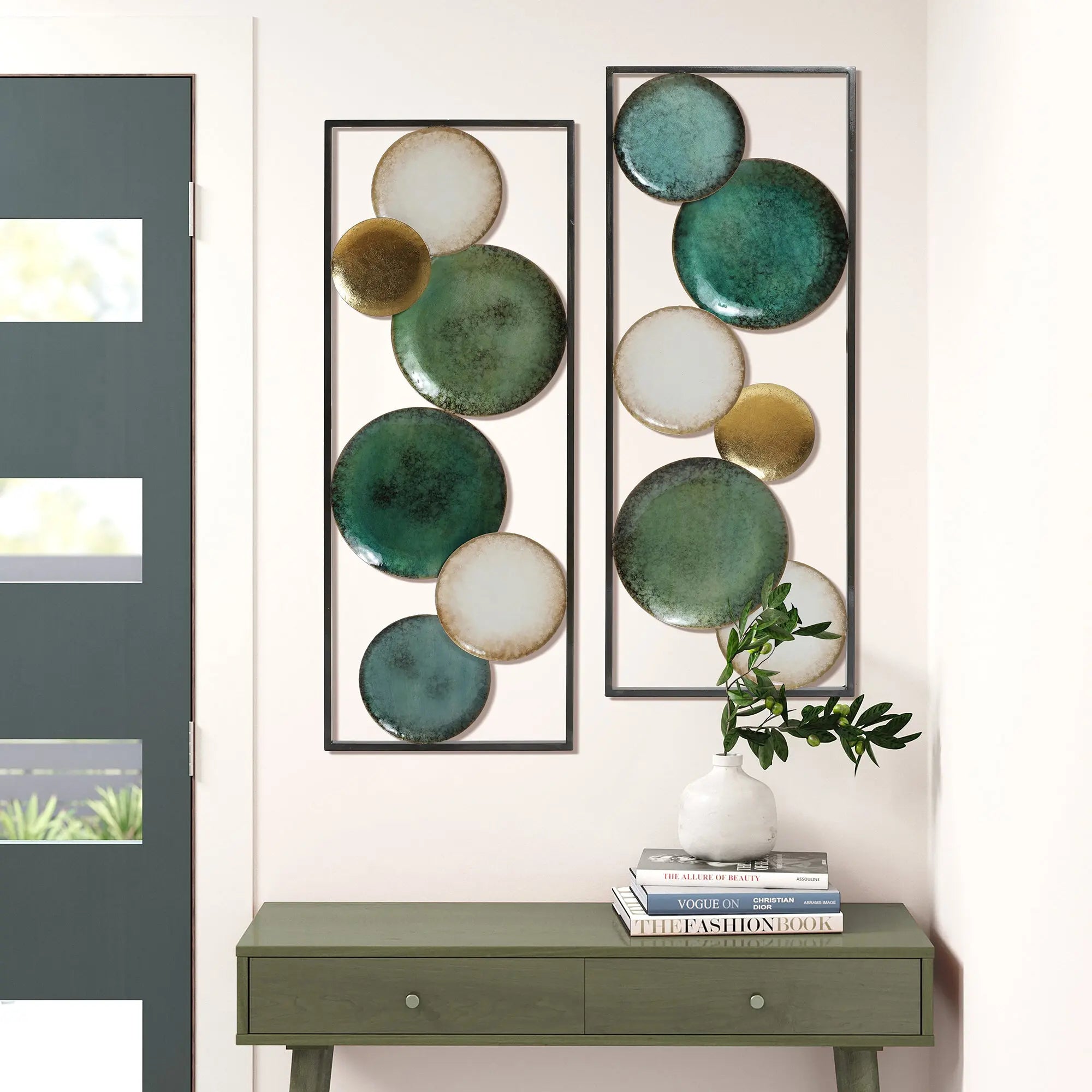 green-console-table-and-a-pair-of-green-and-gold-round-mirrors-hanging-on-the-wall