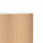 cylindrical-vase-with-a-white-interior-and-a-ribbed-exterior 