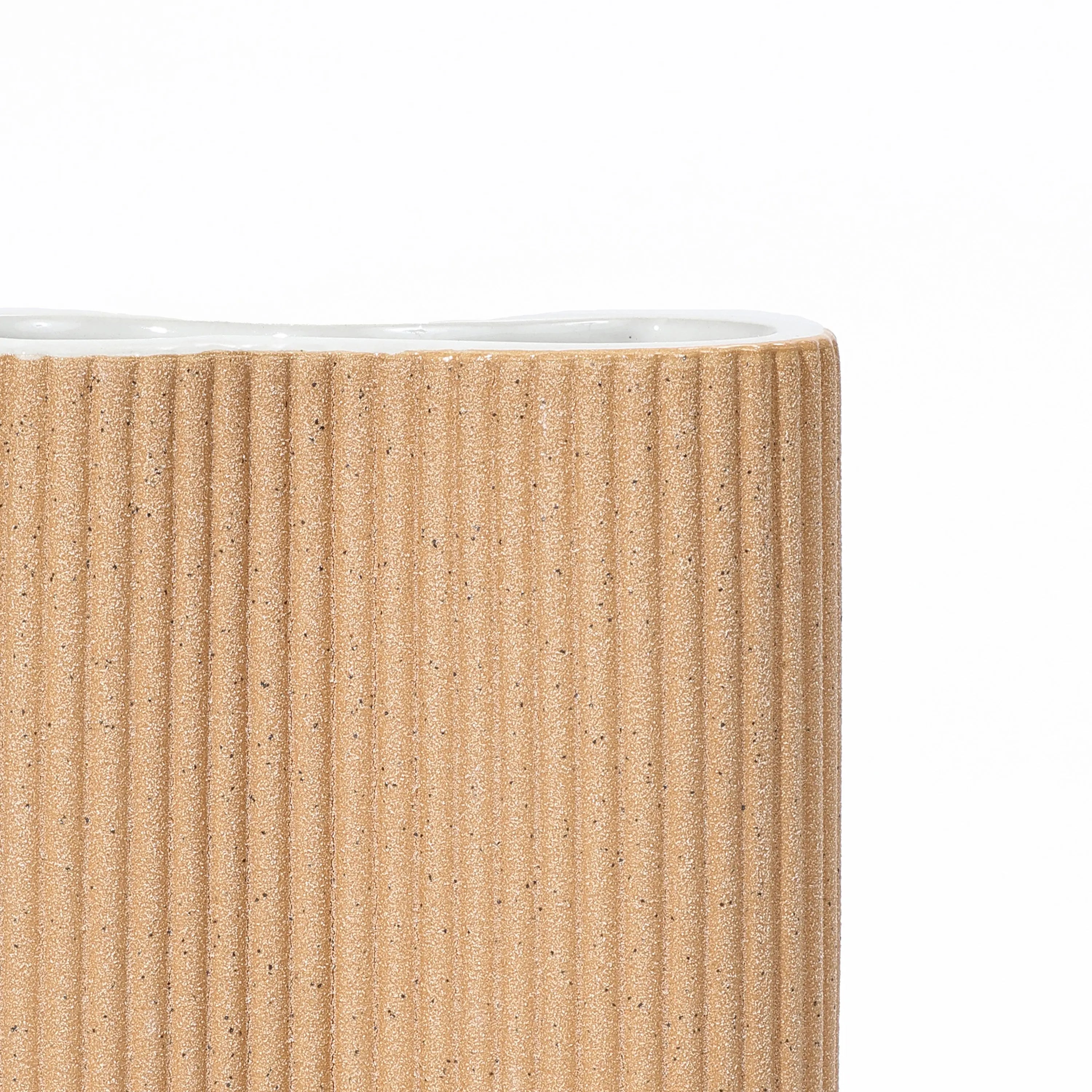 cylindrical-vase-with-a-white-interior-and-a-ribbed-exterior 