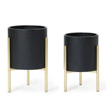 Two black textured planters crafted from durable iron, featuring sleek gold stands, are displayed side by side. This contemporary modern style planter set includes one larger and one smaller pot, adding a touch of elegance to any space.