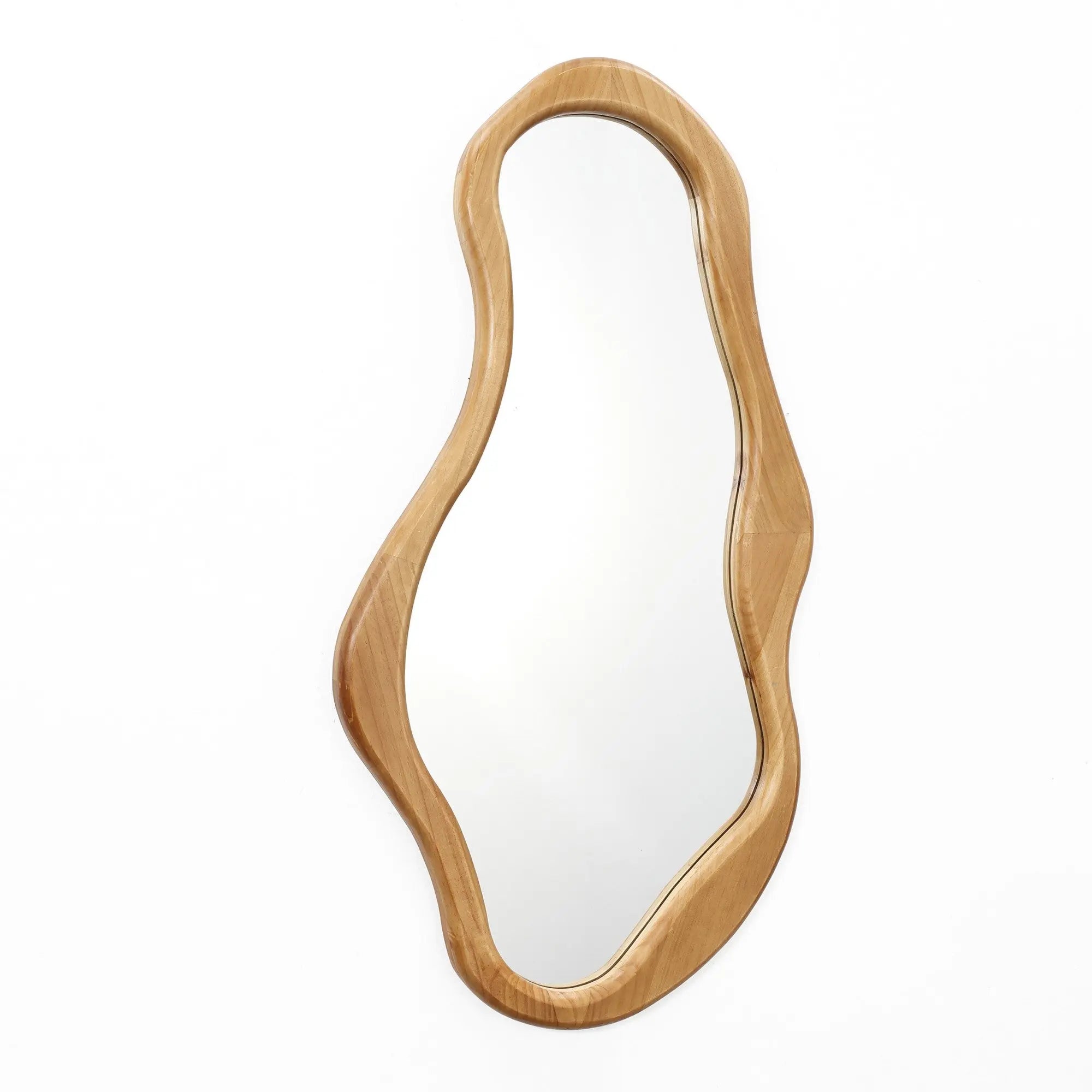 An abstract mirror with a wavy shape, set in a pine frame, exudes natural energy against a crisp white background.