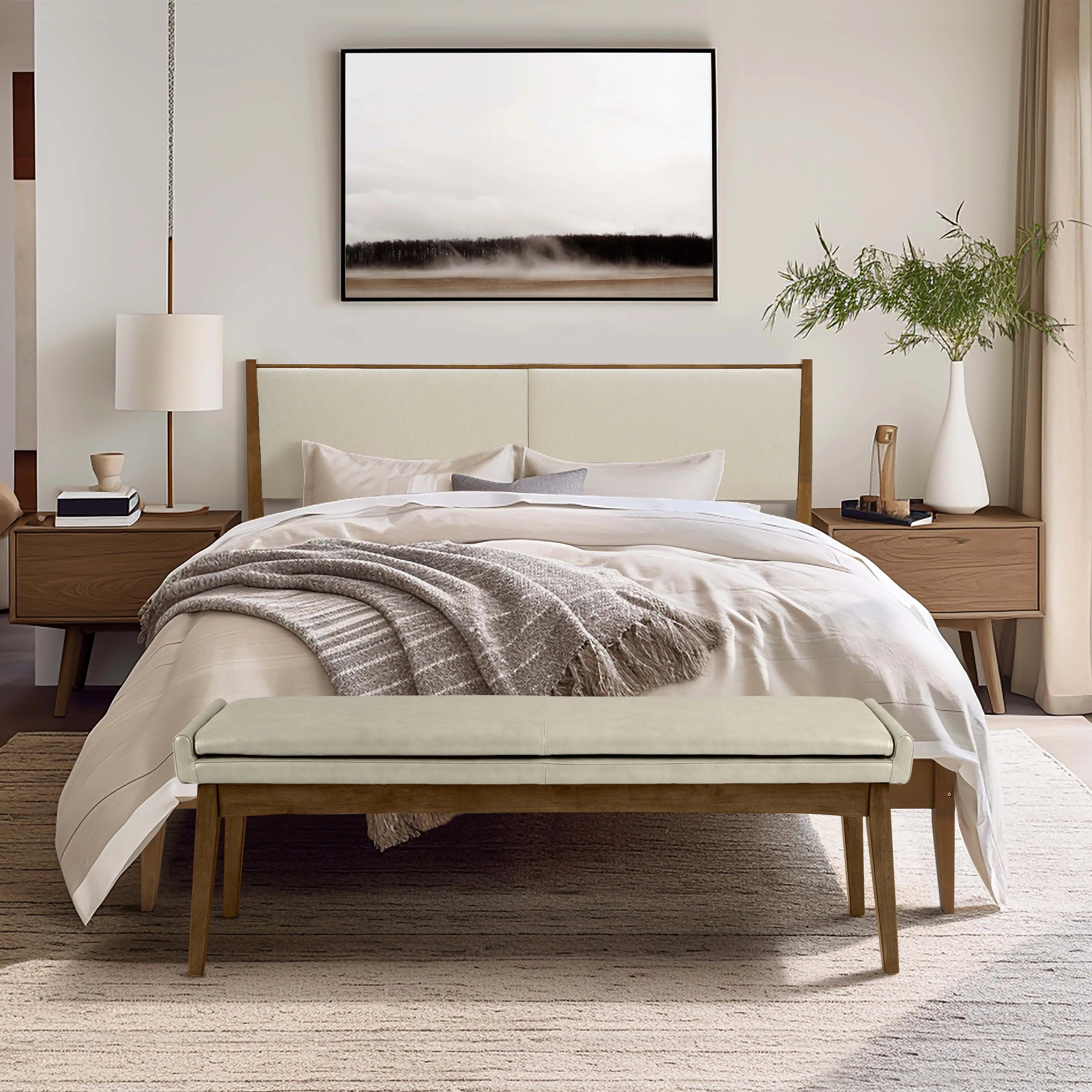 bedroom-with-a-large-bed-a-bench-and-a-TV-above-it