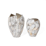 Two tall, textured ceramic vases with irregular, open tops resembling a broken egg design are displayed against a plain white background, making for an exquisite decorative piece.