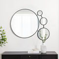 round-mirror-and-two-round-mirrors-on-a-wall