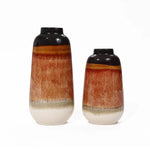 Two vintage ceramic vases grace a white background, flaunting a color block gradient design with black tops, reddish-brown middles, and cream bases. Perfect for home decor, one vase stands taller than the other, offering an elegant visual contrast.