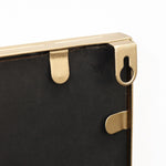 black-mirror-with-a-brass-handle