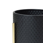 Close-up of a black textured cylindrical container with a diamond pattern, featuring a vertical brass handle on the side. This contemporary modern style planter is perfect for any space, adding both elegance and function to your decor.