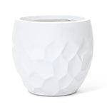 A white textured ceramic planter features a striking geometric pattern and a smooth rim, perfect for both indoor and outdoor use.