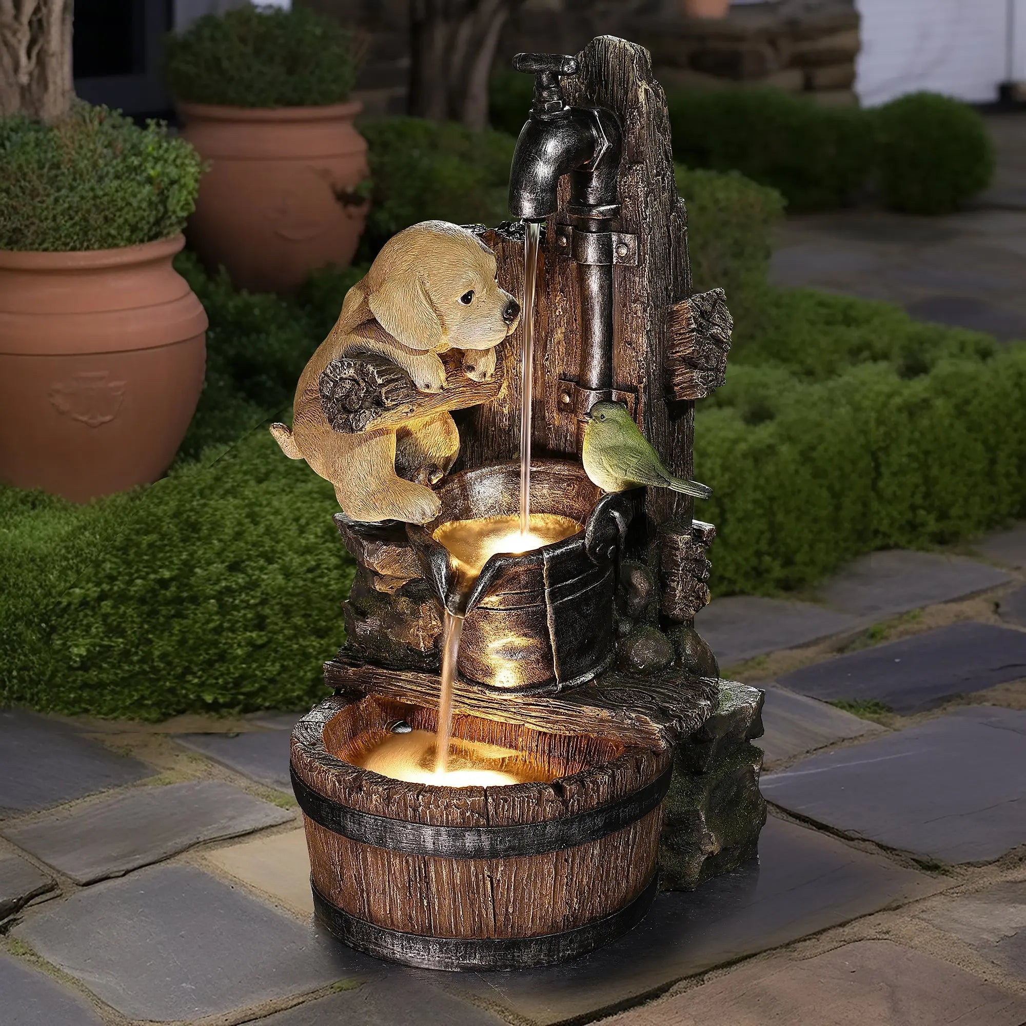  garden-fountain-with-a-playful-dog-a-bird-cascading-water-and-glowing-lights-in-a-rustic-bucket-and-barrel design