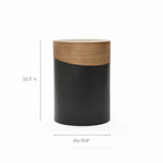 This versatile piece functions as both a decorative side table and a cylindrical stool. It features a sleek two-tone design with a wooden top and dark base, standing at 22.3 inches in height and measuring 15.8 inches in diameter, perfect for any stylish space.