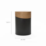 This versatile piece functions as both a decorative side table and a cylindrical stool. It features a sleek two-tone design with a wooden top and dark base, standing at 22.3 inches in height and measuring 15.8 inches in diameter, perfect for any stylish space.