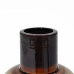 Close-up of the neck of a brown ceramic vase with a glossy finish, exuding coastal-inspired charm. Its cylindrical shape stands elegantly against a white background, perfect for elevating your tabletop decor.