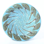 bird bath top has textured pattern like peacock feather