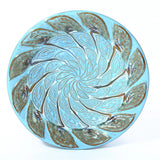 bird bath top has textured pattern like peacock feather