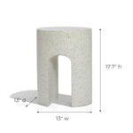 Ivory white, speckled cylindrical stool with a U-shaped base, perfect as an outdoor side table. Dimensions: 17.7 height, 13 width, and 13 depth.