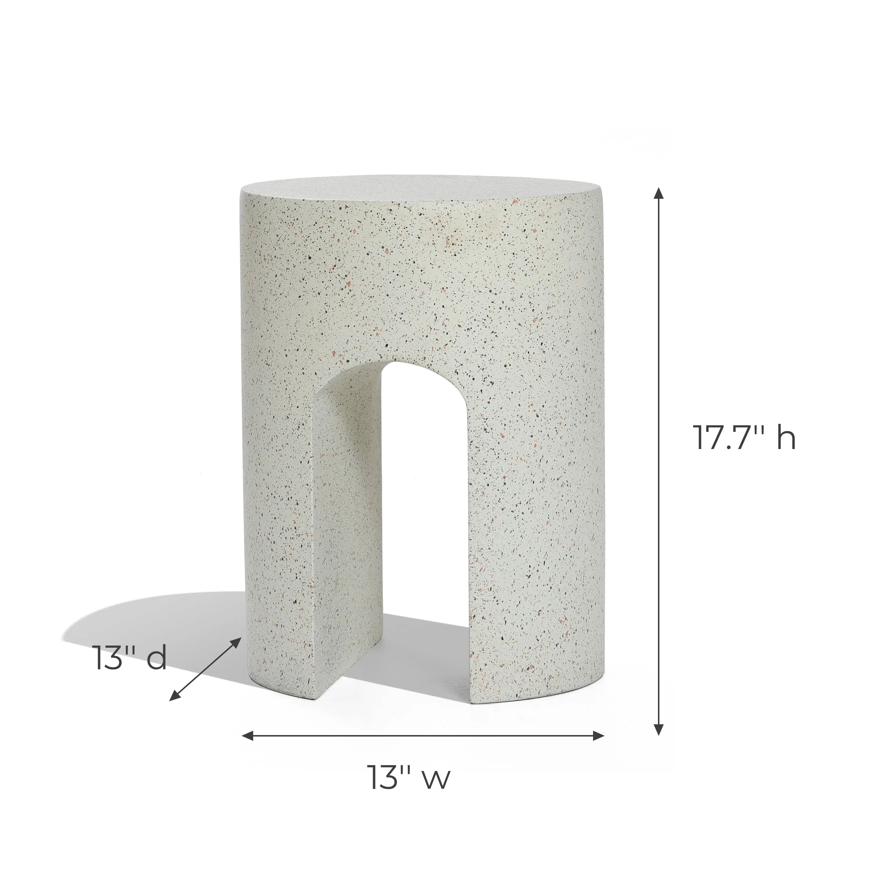 Ivory white, speckled cylindrical stool with a U-shaped base, perfect as an outdoor side table. Dimensions: 17.7 height, 13 width, and 13 depth.