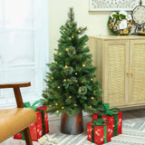 small-pre-lit-artificial-christmas-pine-tree-with-metal-pot-on-the-ground-with-gift-box