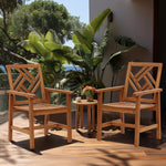 two-wooden-chairs-and-a-table-on-a-deck-with-a-potted-plant-and-a-view-of-the-ocean  